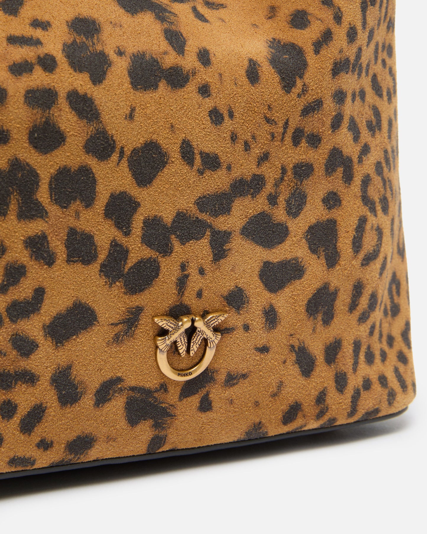 Small crossbody bucket bag in leopard-print suede