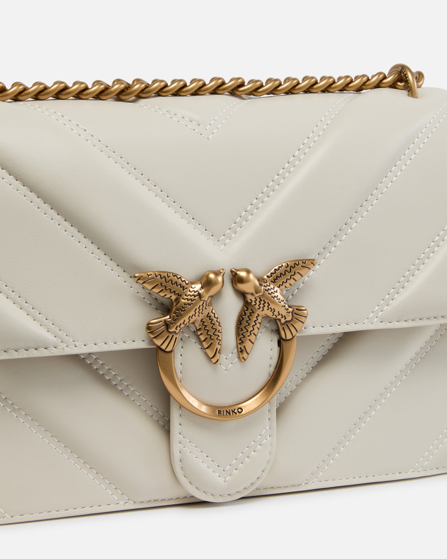 Medium Love Bag pebbled leather crossbody bag with V-shaped pattern and logo