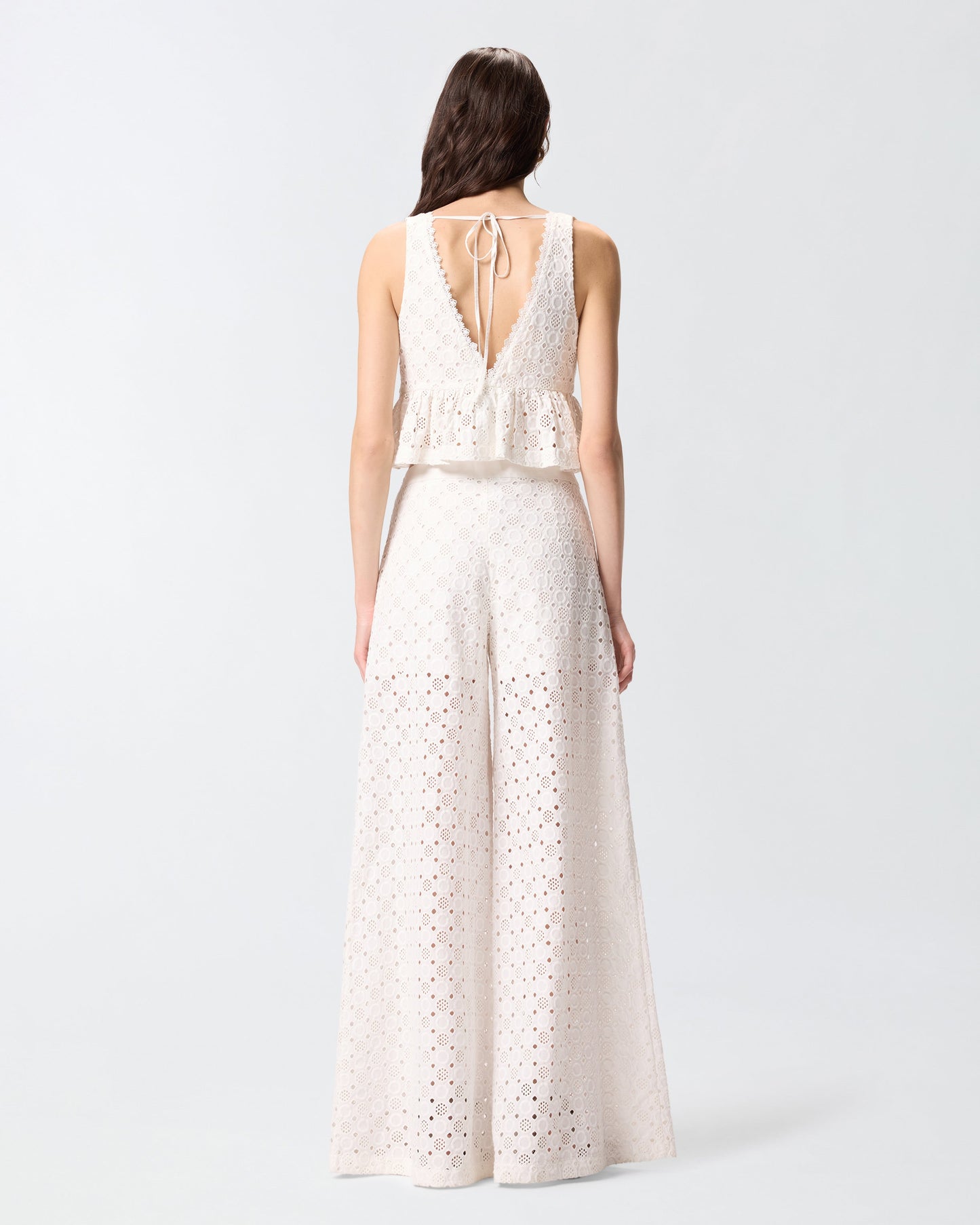 Crop top with ruffle and openwork pattern