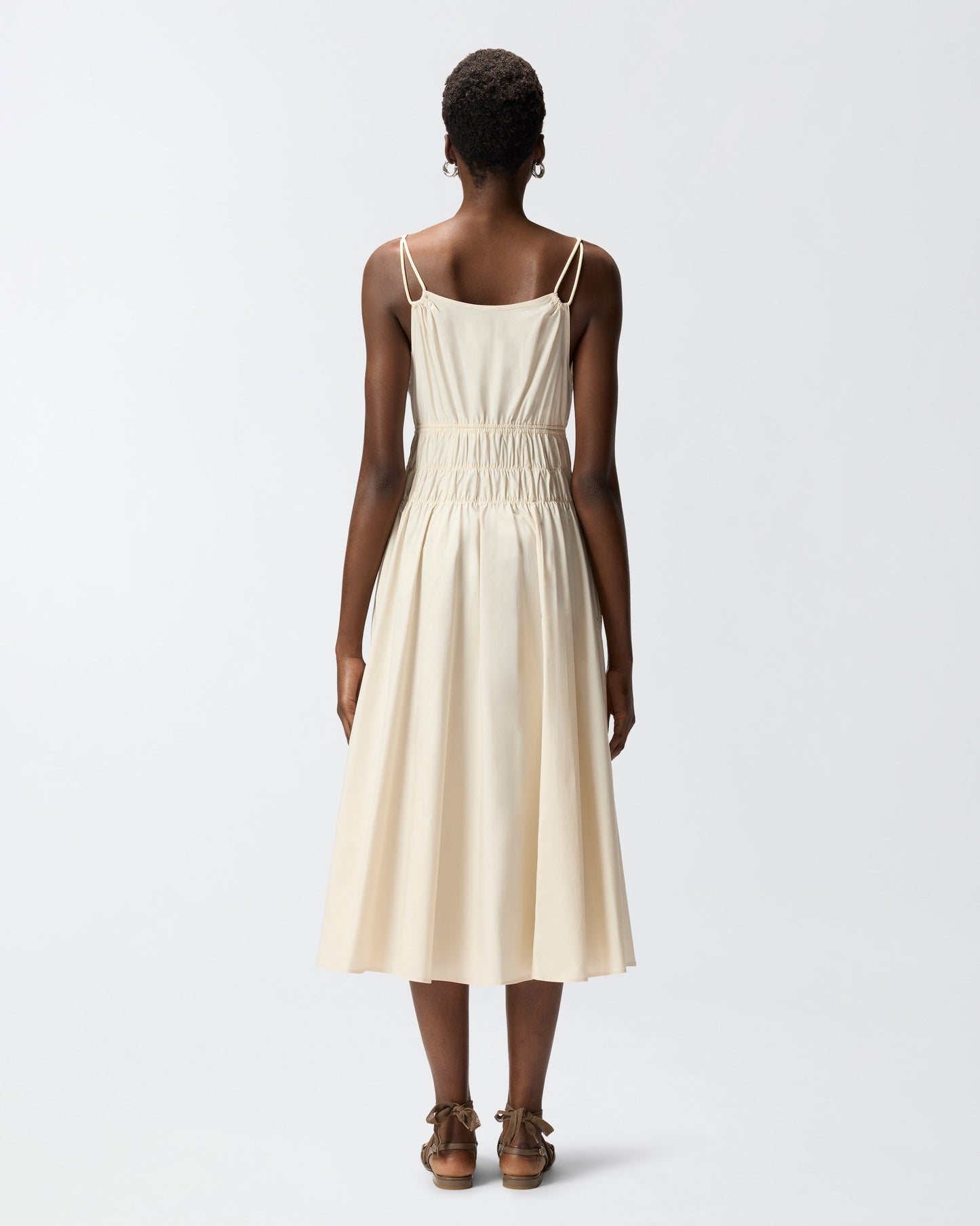 Sleeveless midi dress with pleats and gathering