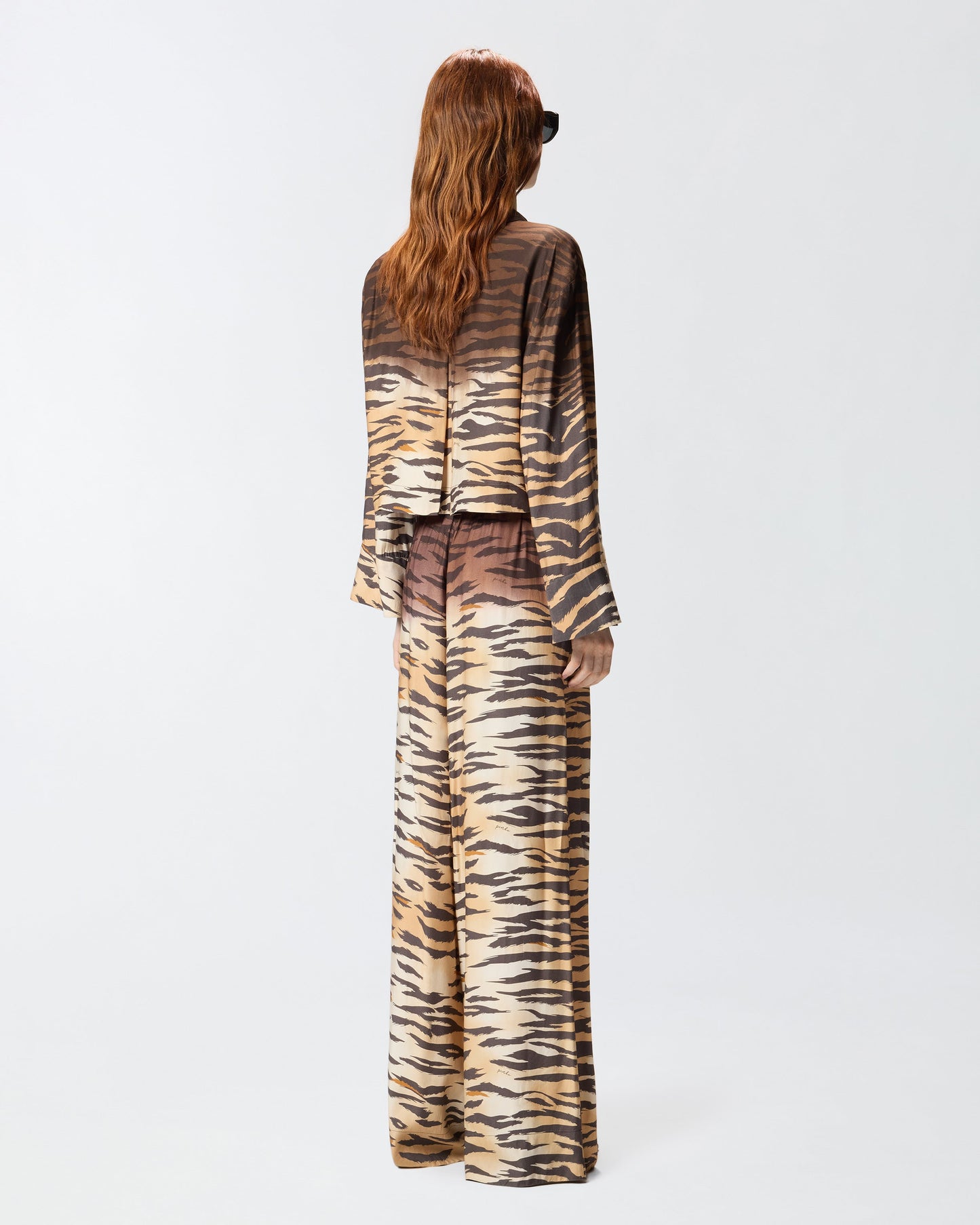 Fluid trousers with tiger print