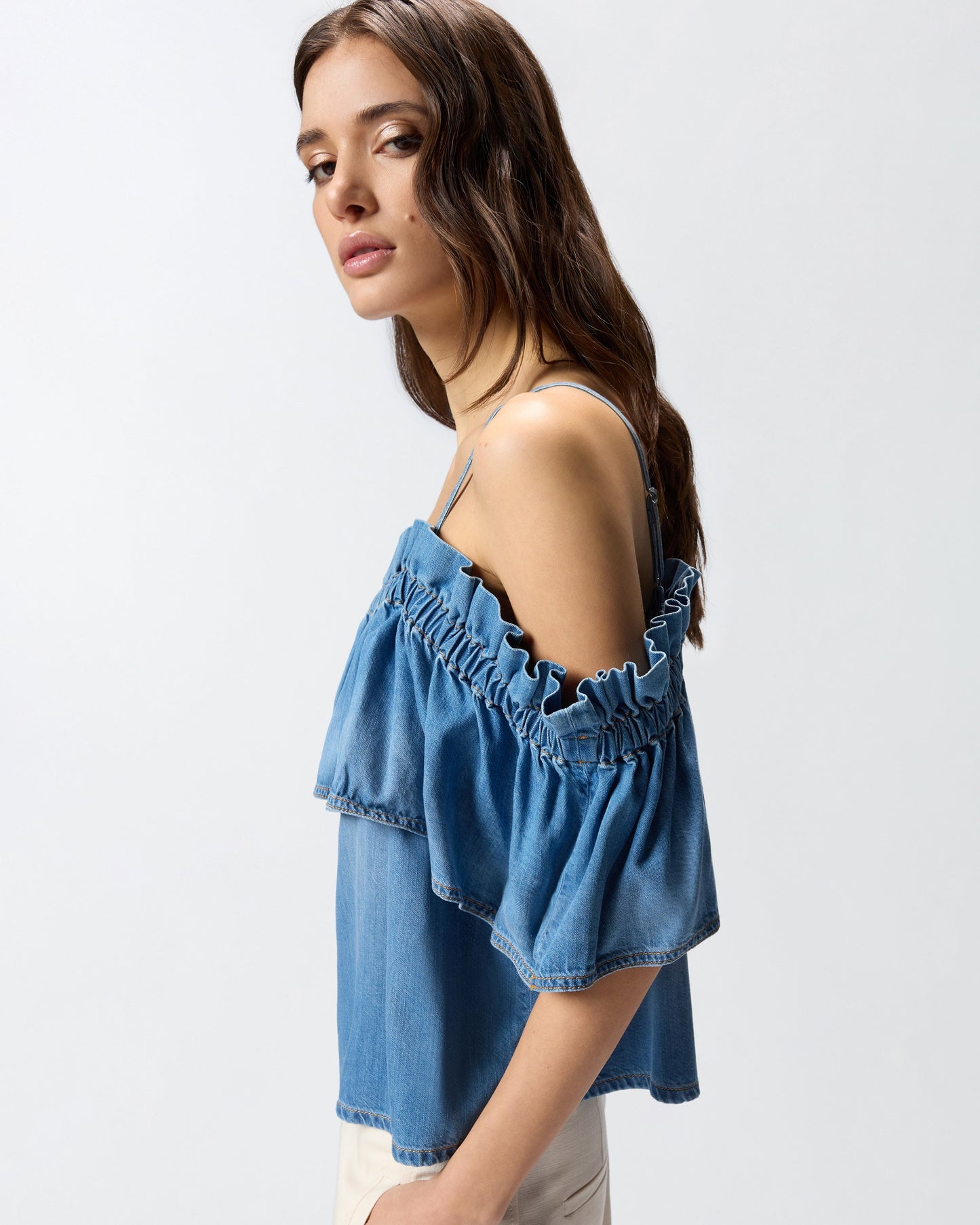Denim top with ruffle and open shoulders