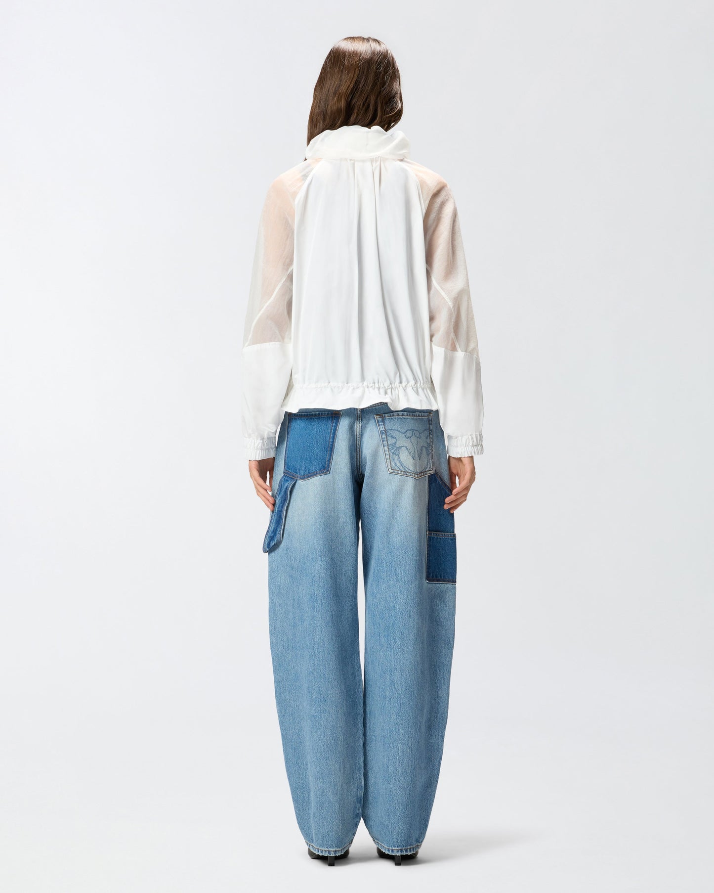Technical jacket with sheer inserts