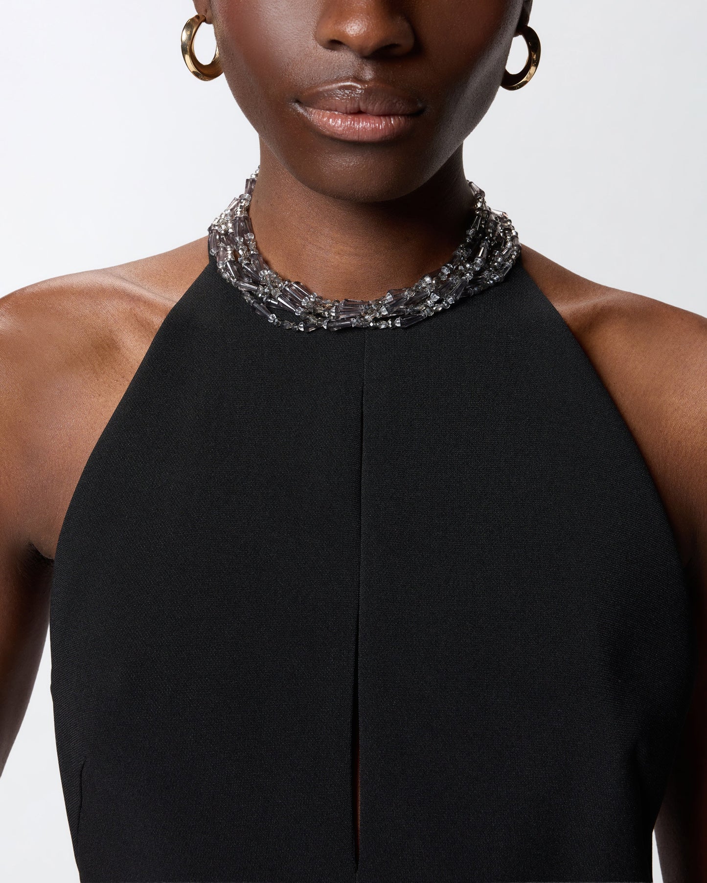 Long playsuit with halterneck and jewel decoration