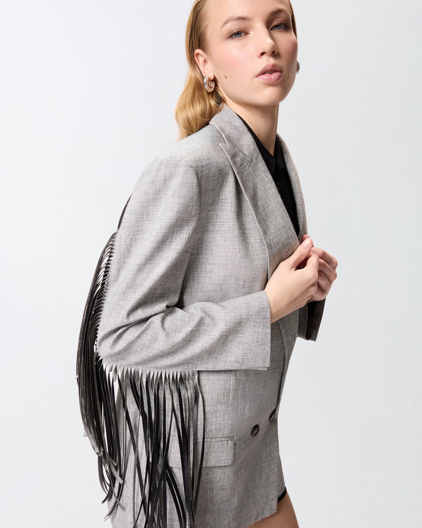 Double-breasted jacket with fringing