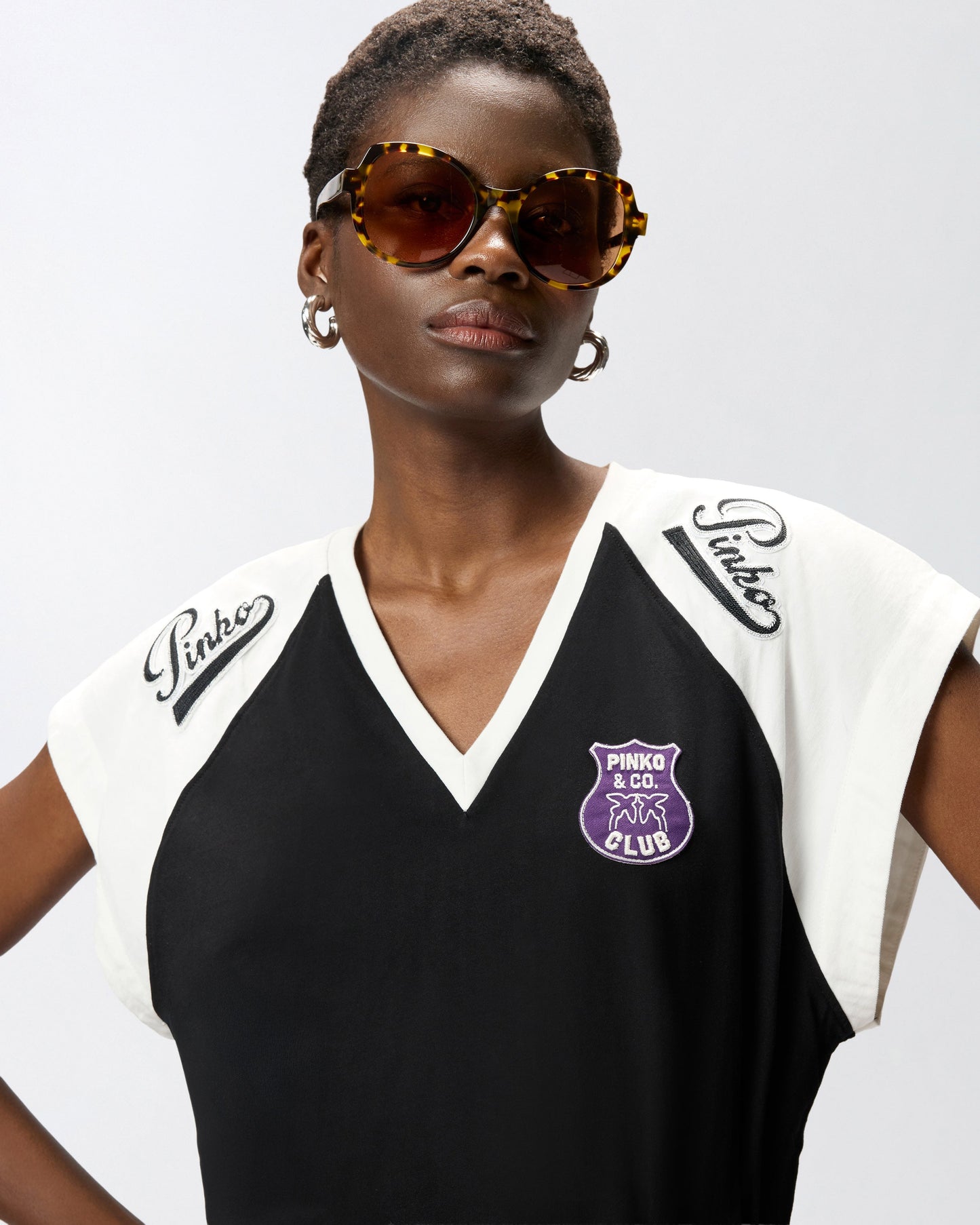 T-shirt with V-neck and branded patches