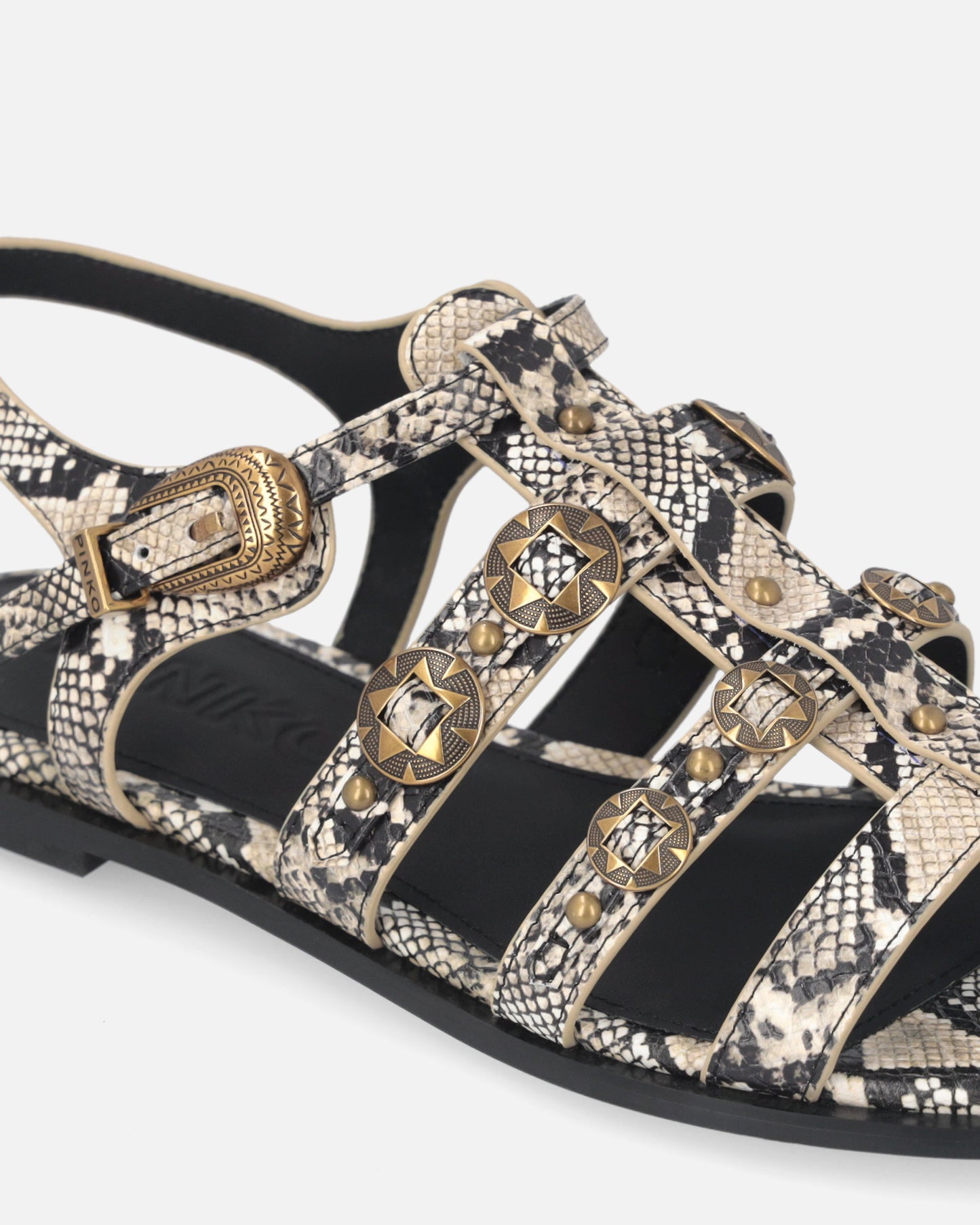 Flat leather sandals with python print and studs